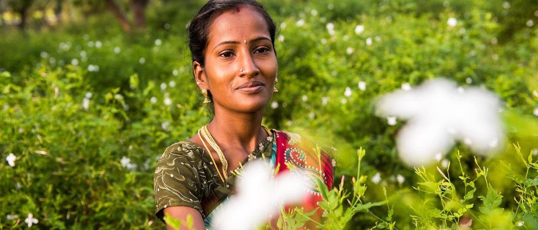 woman with flowers in field